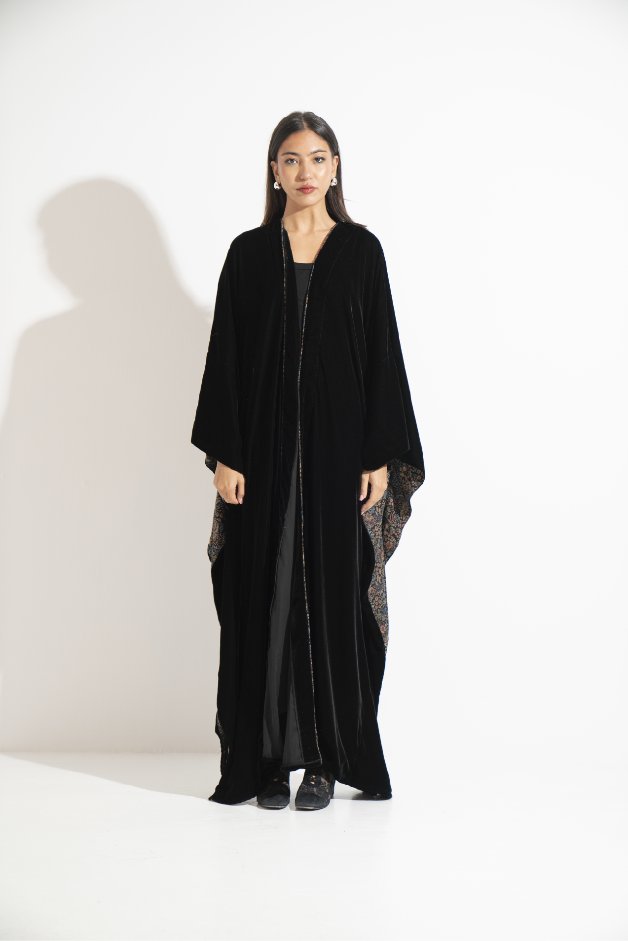 Black velvet abaya with a patterned interior lining  A12